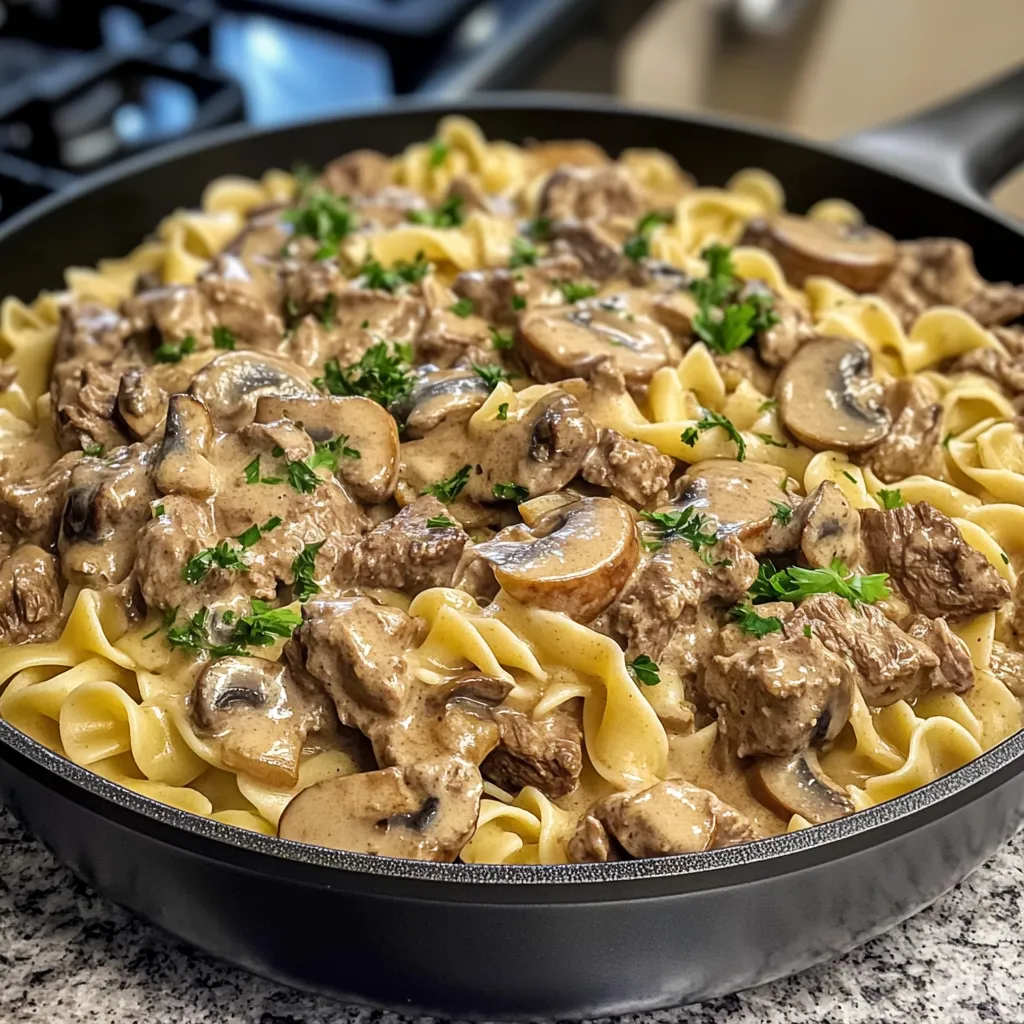 A one-pot beef stroganoff meal in a pan.