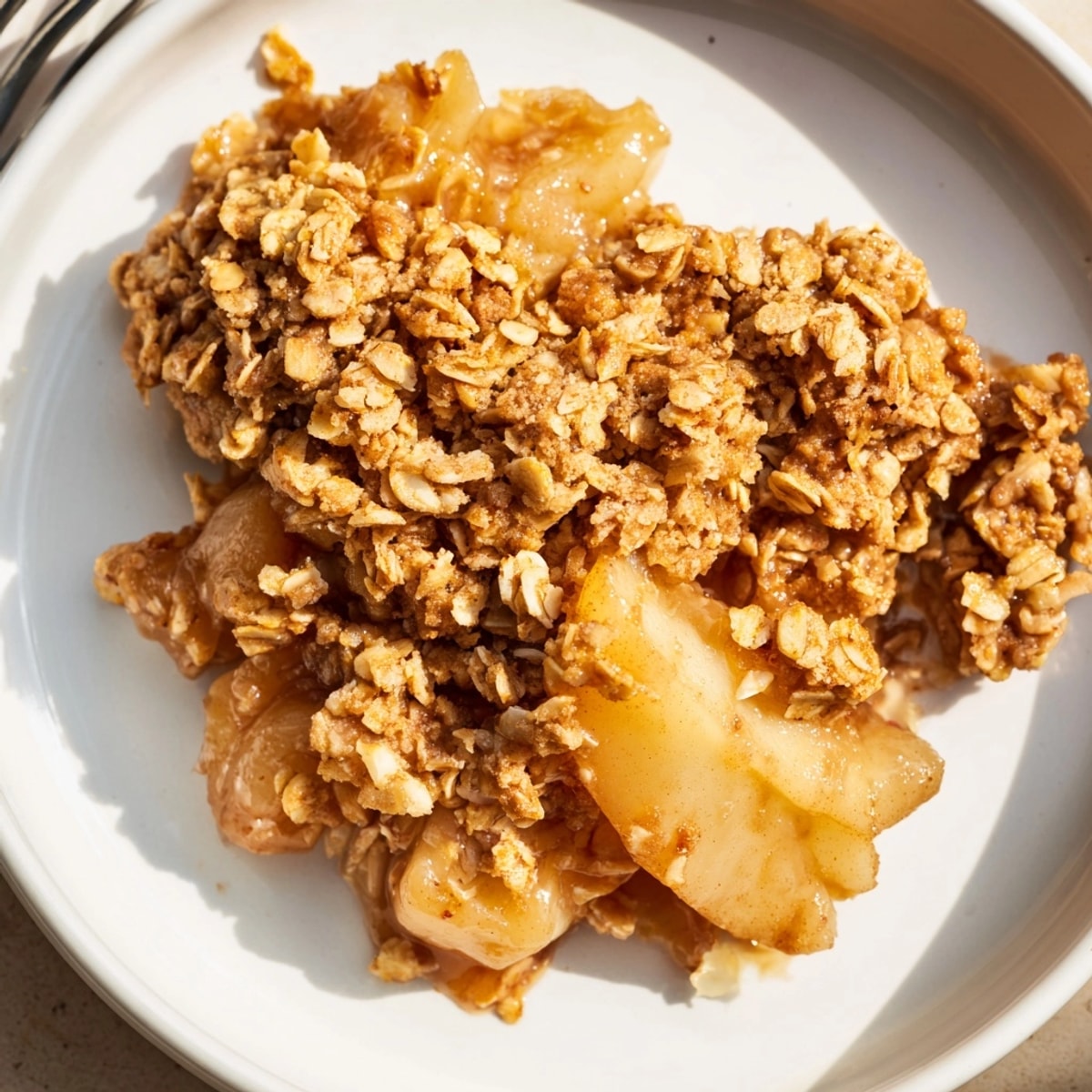 Golden Cinnamon Caramel Pear Crumble, bubbly and warm, ready to be served with ice cream.