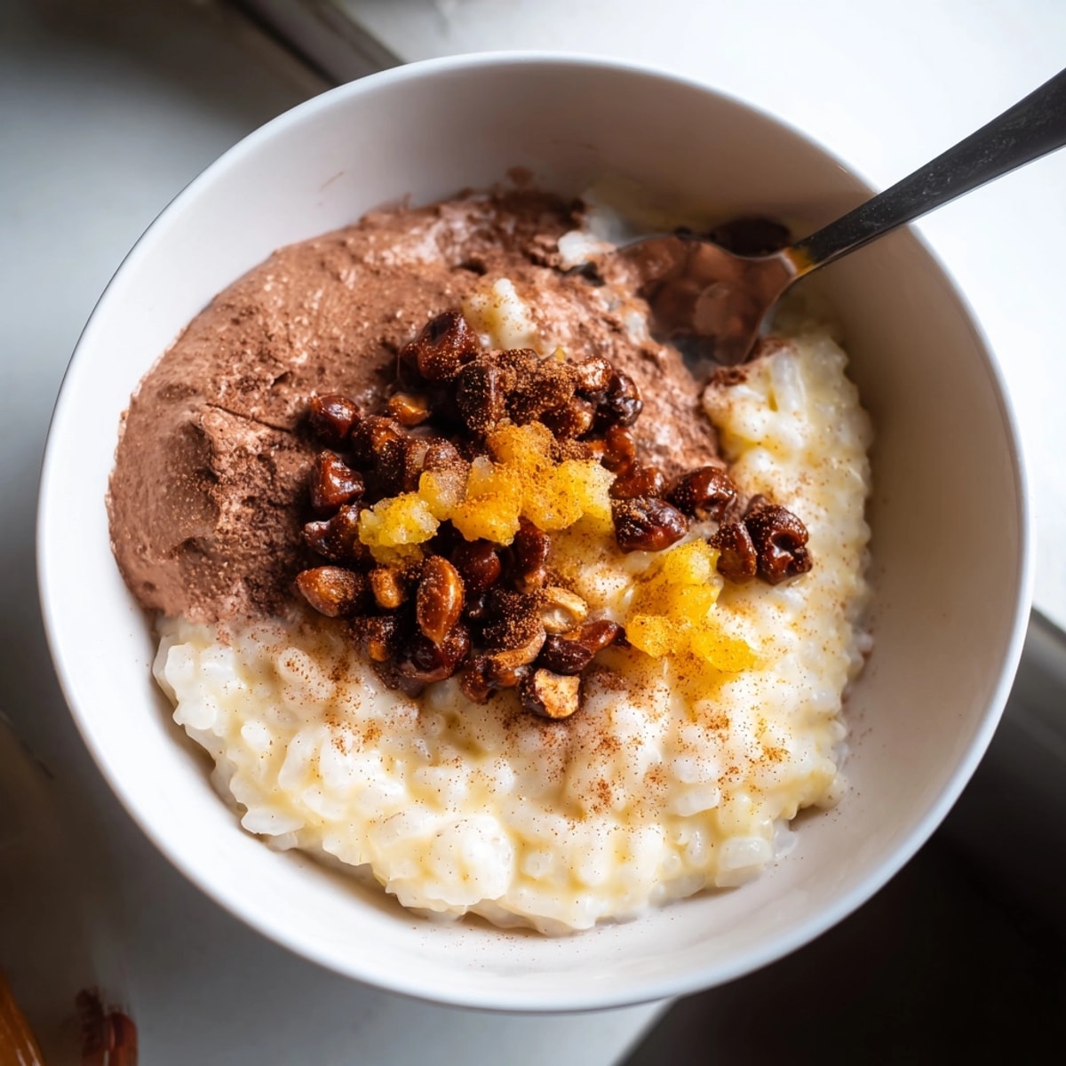Close-up of silken Japanese Rice Pudding with Chestnut Cream, garnished with candied chestnuts.