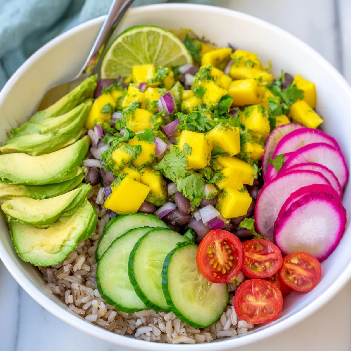 Hearty black beans and sweet mango salsa create vibrant Mango Salsa Black Bean Bowls.
