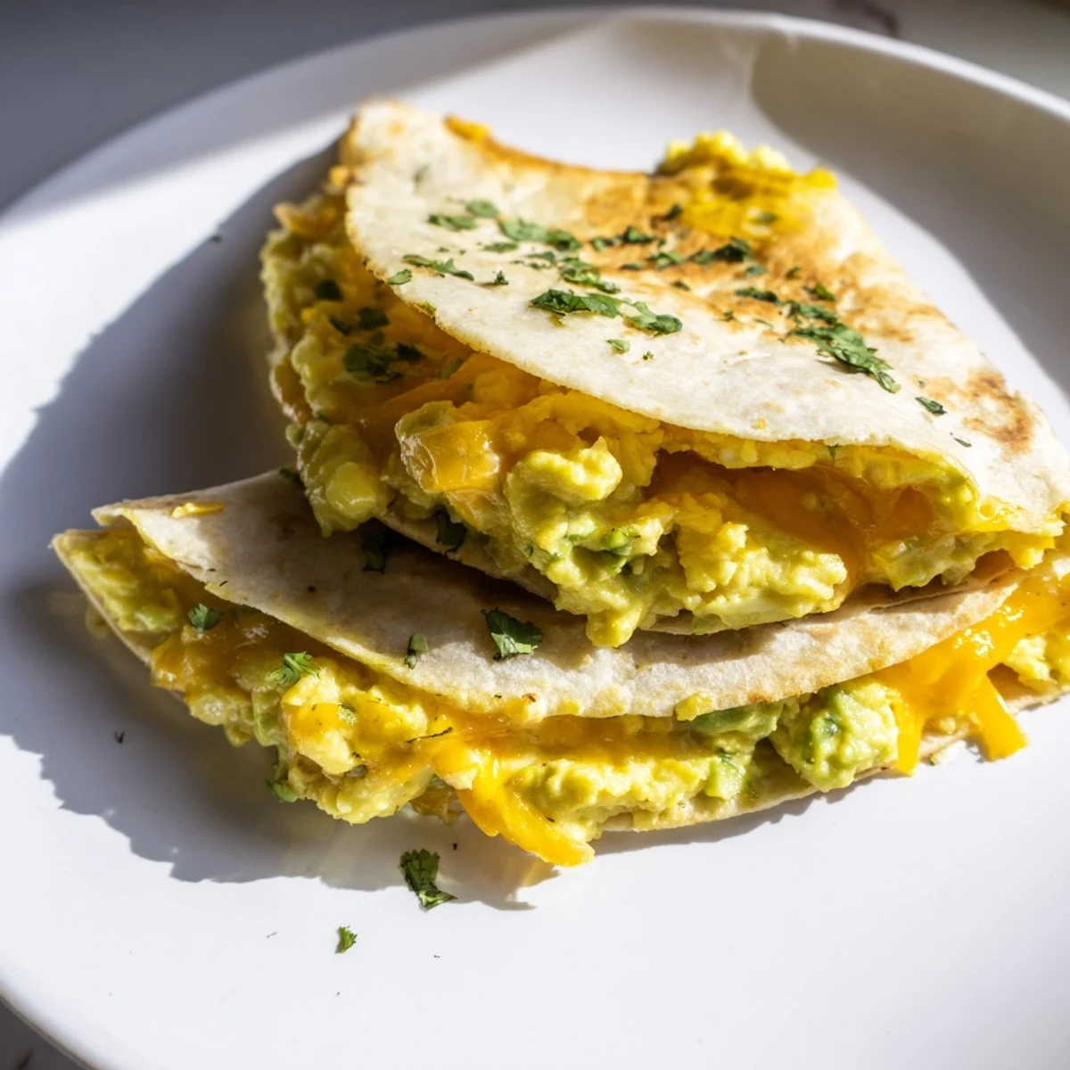 Creamy Avocado Egg Cheddar Quesadillas served hot with salsa and cheese melting.