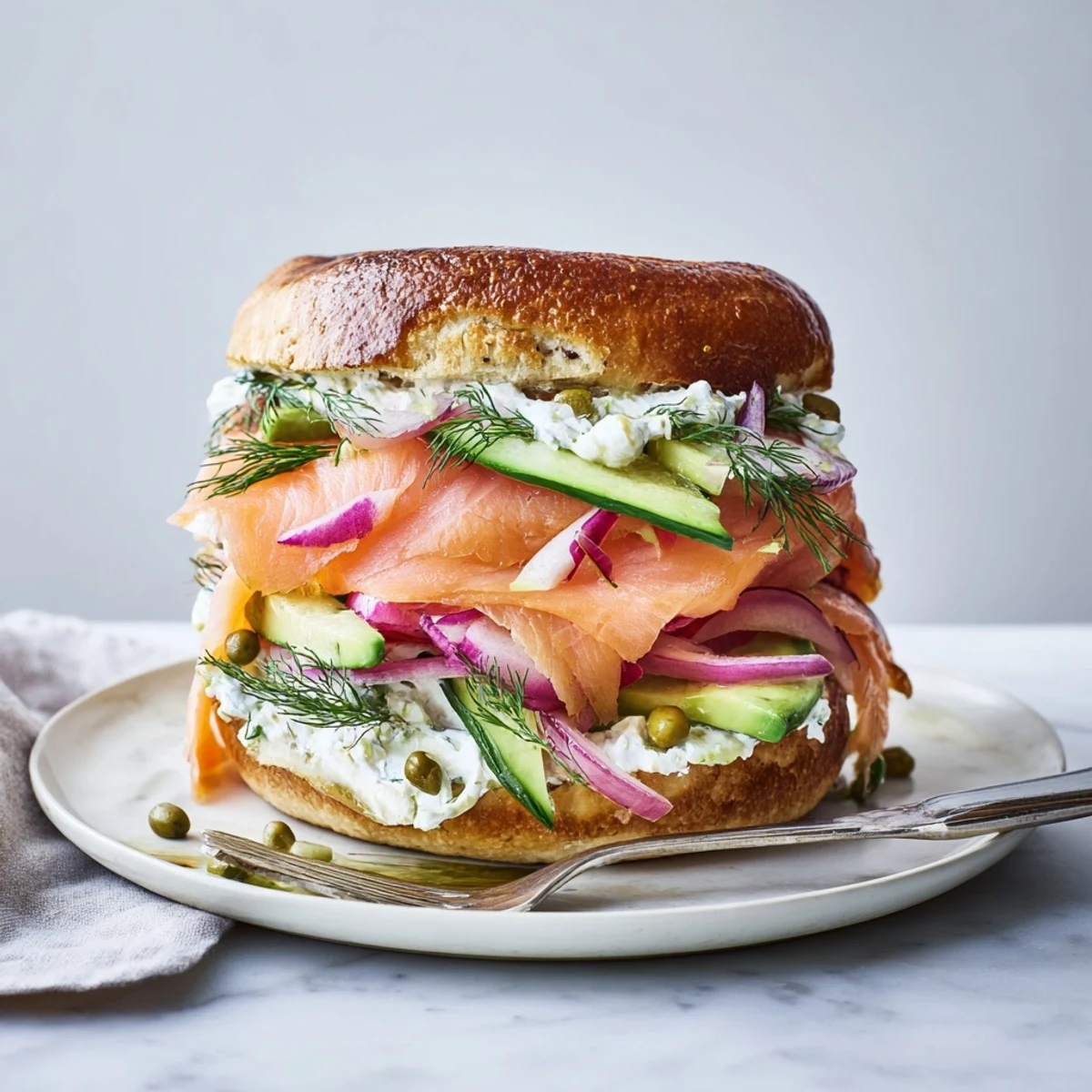 Delicious smoked salmon & dill bagel sandwiches served with creamy dill spread and capers.  