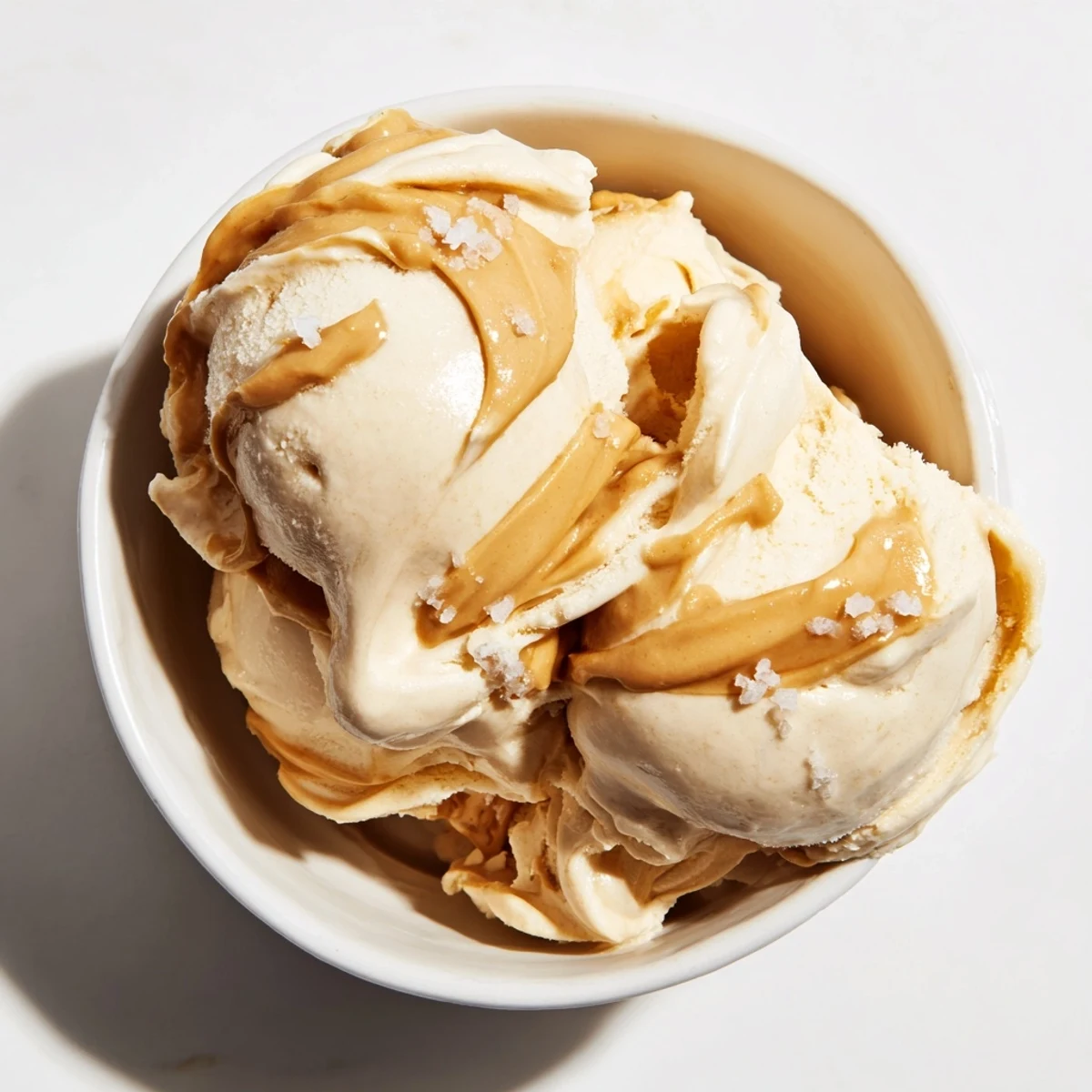 Creamy peanut butter banana ice cream swirls, a healthy and delicious frozen dessert option.