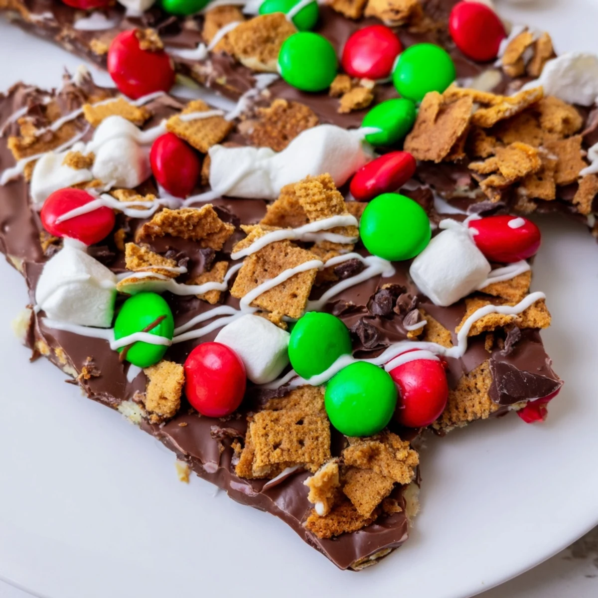 Rich chocolate studded with graham cracker pieces makes this Quick Christmas Smores Bark a holiday must-have dessert.