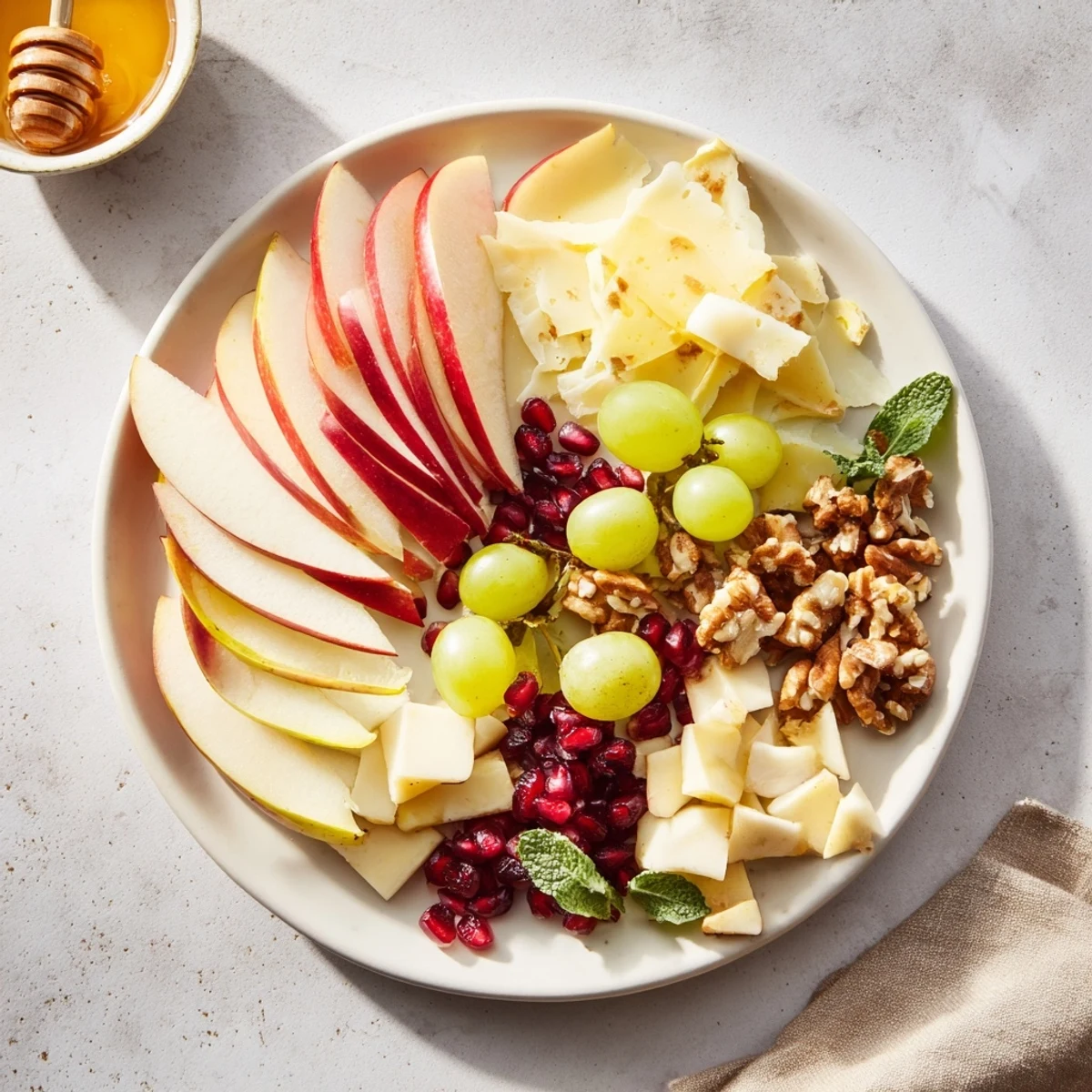 A beautifully arranged Apple Orchard Fruit Board with vibrant apples, grapes, and cheese for snacking.