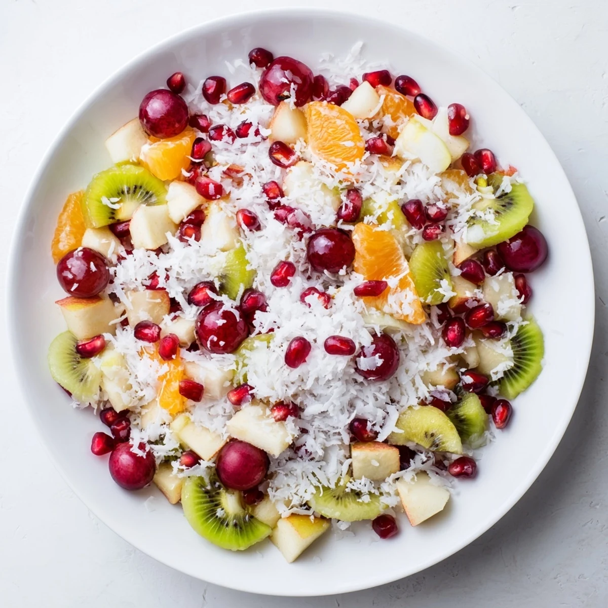 The light citrus dressing glistens over this colorful Snowflake Fruit Medley, perfect for a festive dessert.