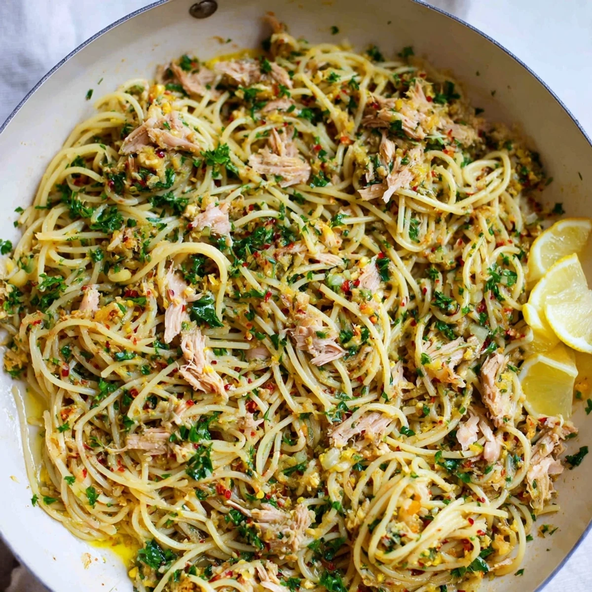 Fragrant lemon-garlic tuna spaghetti: A beautifully plated dish, ready for a delicious Mediterranean dinner.