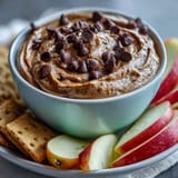 Creamy, fiber-packed chickpea cookie dough dip served with fresh fruit.