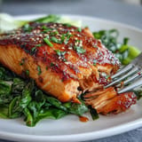 Tender miso glazed salmon nestled beside vibrant, garlicky sesame bok choy.