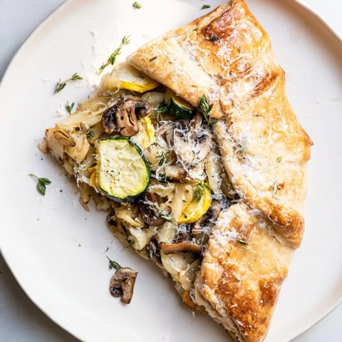 Delicious Garlic Parmesan Dinner Galette: Golden pastry with creamy, roasted garlic filling.