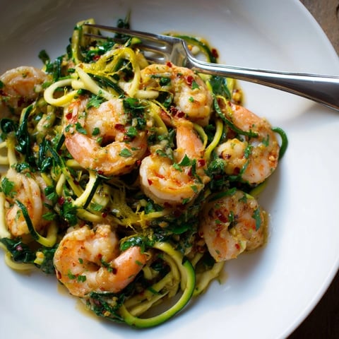 Shrimp Scampi Zucchini Noodles: Sautéed shrimp and zoodles glistening in a lemon-garlic sauce.