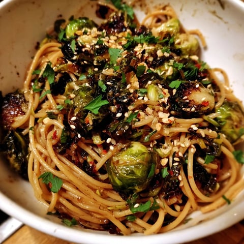Close-up of glossy, caramelized Maple-Soy Roasted Brussels Sprouts Pasta, ready to serve.