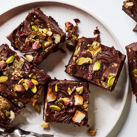 Decadent chocolate bar inspired creations topped with crunchy pistachios and rose petals.  