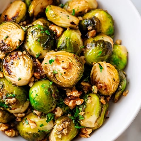 Tender maple glazed Brussels sprouts with walnuts, a delightful vegetarian side dish.  