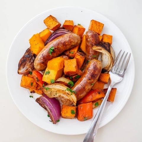 Sheet Pan Roasted Sausage, Squash & Root Vegetables, a golden-brown sheet pan meal, perfect for a hearty dinner.