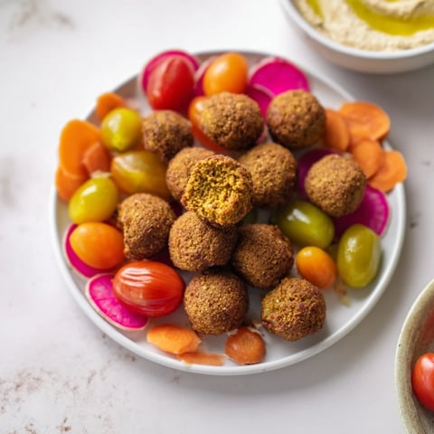 Festive Gluten-Free Holiday Falafel Board: a colorful platter filled with crispy falafel and vibrant dips.