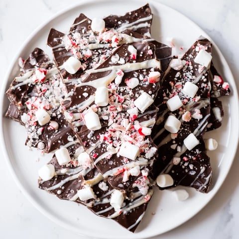 Rich, delicious Hot Chocolate Bomb Bark with marshmallows and peppermint, ready to break and enjoy.