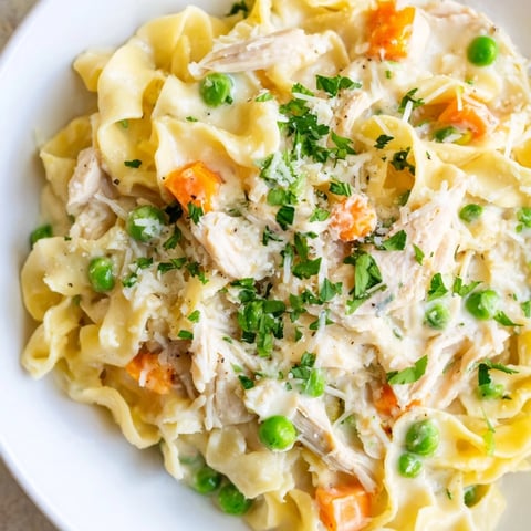 Warm spring chicken noodle skillet, a creamy comforting meal with tender chicken and veggies.