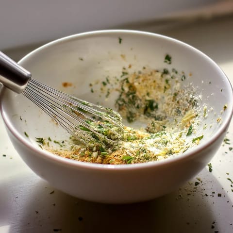 A bowl of garlic and parmesan seasoning.