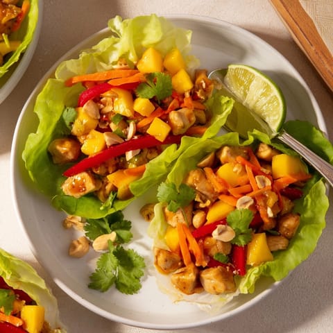 Fresh mango chili chicken lettuce cups, a vibrant explosion of summer flavors.