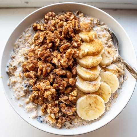 Warm cinnamon-scented Protein Cinnamon Crunch Oatmeal with a delightful crunchy topping.  