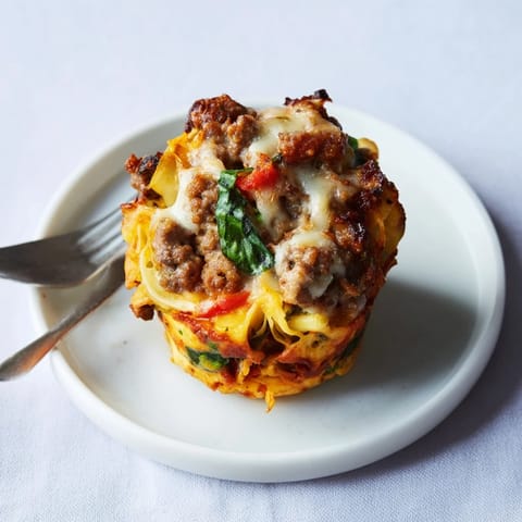 A warm tray of Spicy Lasagne Soup Egg Muffins, bursting with savory Italian flavors.  