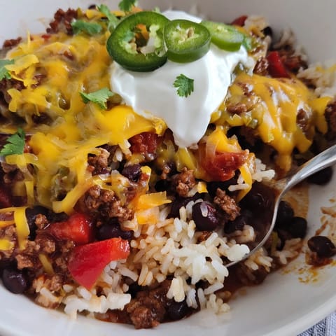 Savor robust flavors in this Tex-Mex Beef & Rice Casserole, perfect for weeknight dinners.  