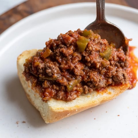 Homemade Sloppy Joes: a messy and delicious meal, served on lightly toasted hamburger buns.