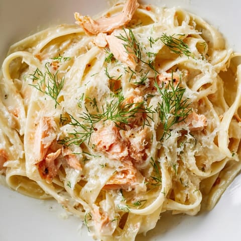 Flaky hot-smoked salmon tossed in a rich cream sauce with fettuccine and fresh herbs.
