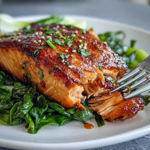 Tender miso glazed salmon nestled beside vibrant, garlicky sesame bok choy.