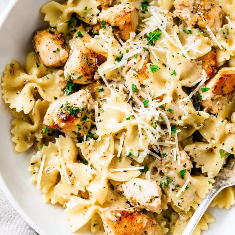 Creamy bowtie pasta and chicken in molten mozzarella garlic butter sauce, deliciously comforting.  