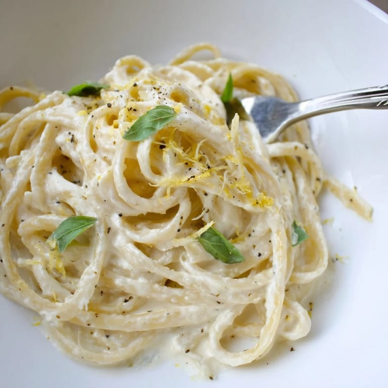 Close-up of Lemon Basil Ricotta Pasta beautifully plated, highlighting its creamy texture and herbs.