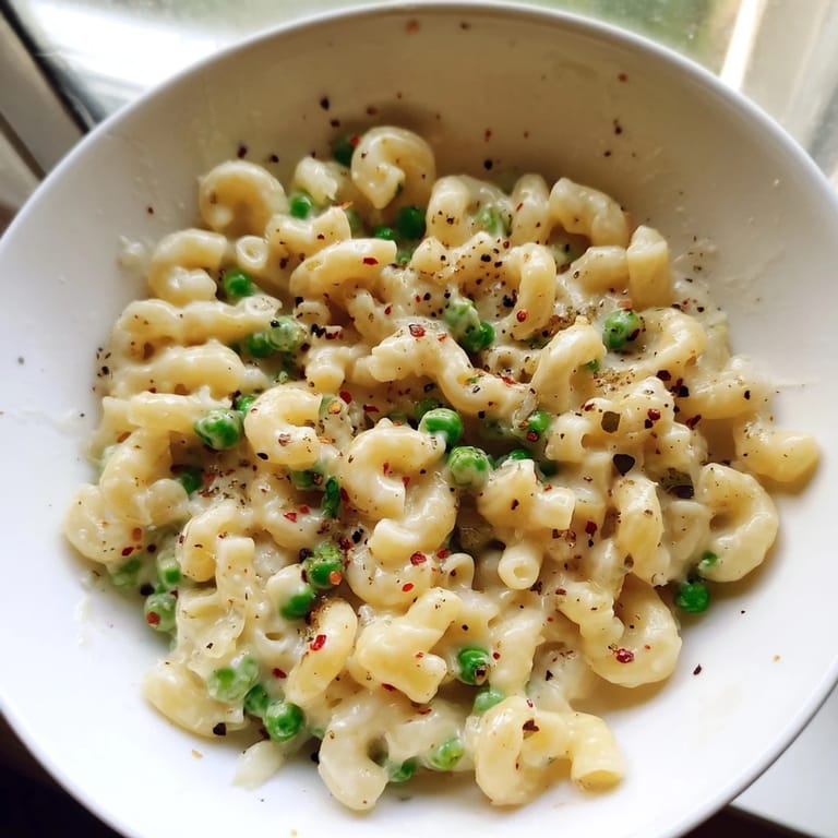 Perfect weeknight meal: Vibrant Macaroni & Peas with a creamy sauce and tender pasta.