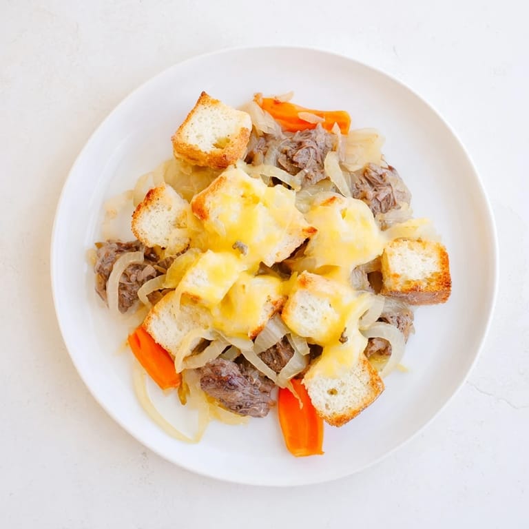 Hearty French Onion Pot Roast Casserole, a comforting blend of beef, onions, and cheesy goodness.