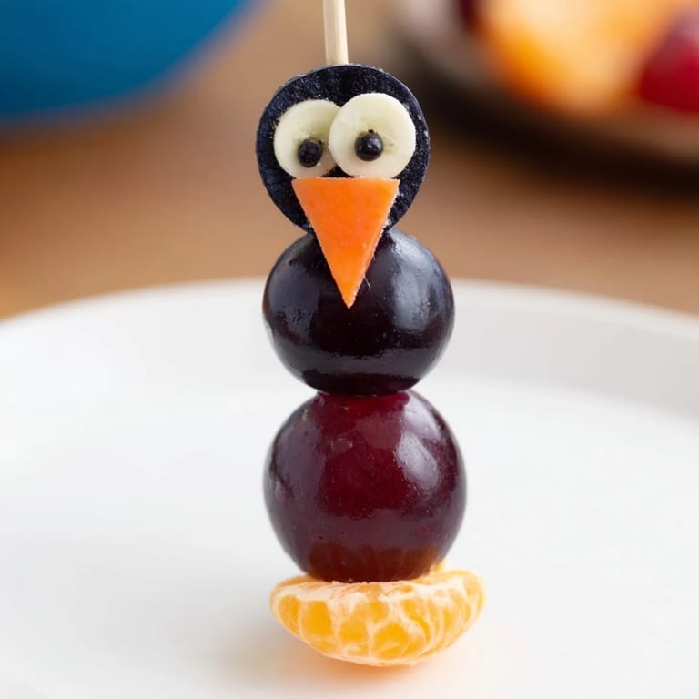 Close-up of a delightful Penguin Fruit Skewer Army; imagine the taste of fresh fruit!