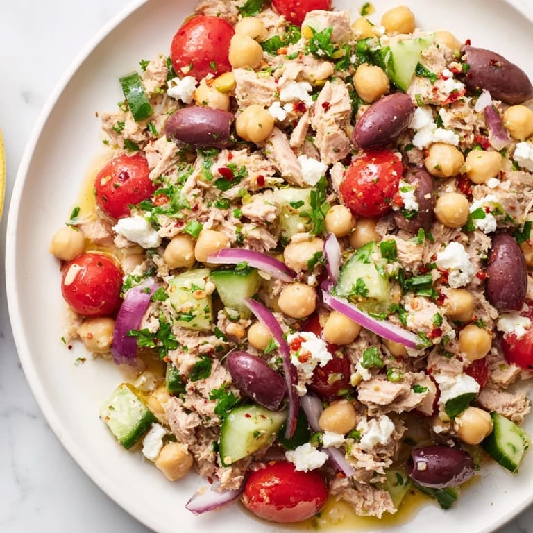 Delicious and healthy Tuna Chickpea Salad, a refreshing light dinner option piled high.