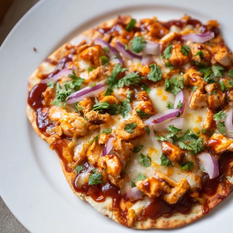 Imagine slicing this delicious BBQ Chicken Flatbread, a flavorful pizza alternative, ready to eat!