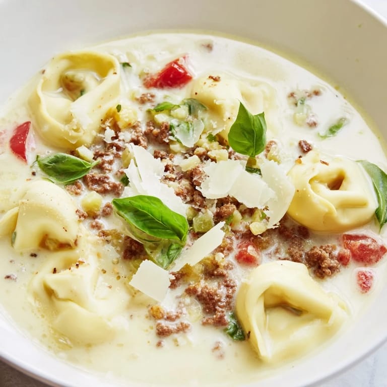 Rich, creamy Tortellini Beef Soup with visible ground beef and perfectly cooked tortellini pasta.