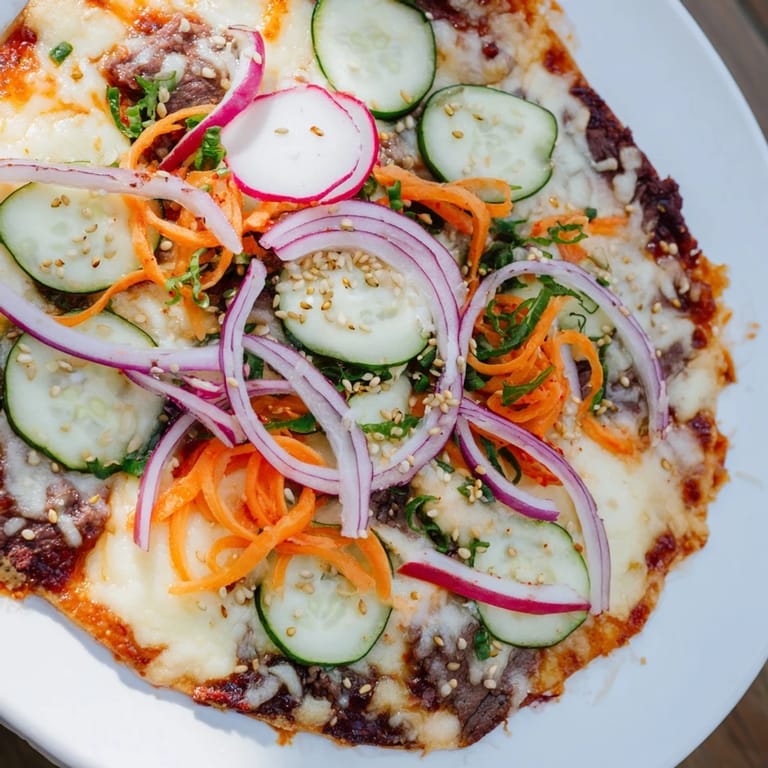 Golden, bubbly cheese blankets crispy tortilla chips loaded with flavorful Korean BBQ beef nachos.