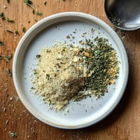 A bowl of homemade garlic butter seasoning.