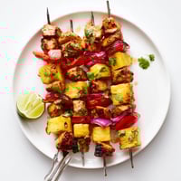 Juicy Sweet & Savory Pineapple Chicken Skewers grilled with colorful veggies and vibrant flavors.  