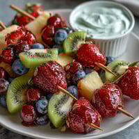 Fun Kid Lunch Bento Box with Fruit Skewers and Dip: colorful skewers of strawberry, pineapple, and kiwi paired with creamy yogurt dip and fresh veggie sides.  