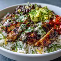 Vibrant High Protein Chicken Burrito Bowl bursting with colorful fresh toppings imaginable.